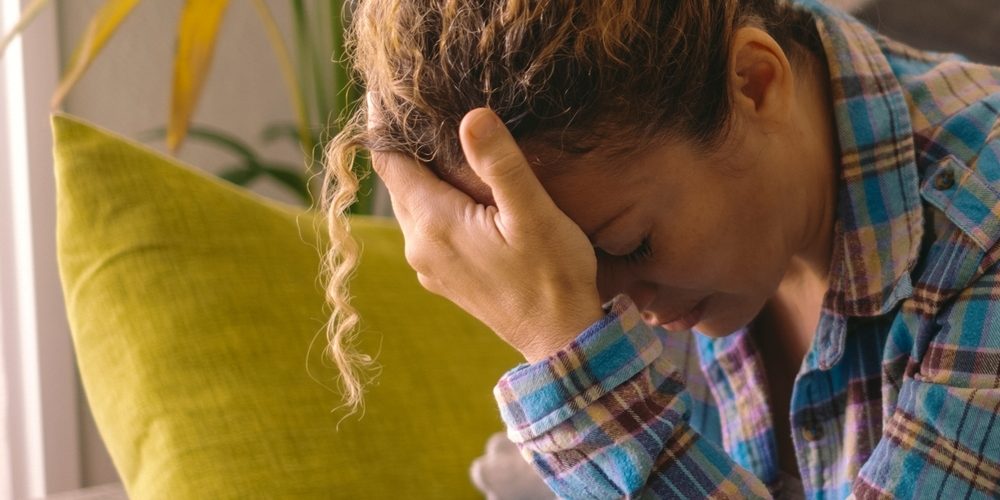 One,Exhausted,And,Stressed,Woman,At,Home,Sitting,On,The